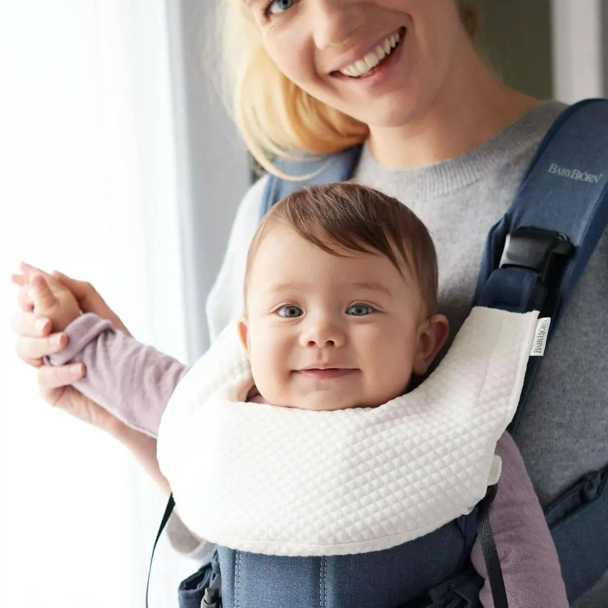 Certainly! Heres an optimized product title with modifiers:  

Convertible BabyBjorn Teething Bib for Baby Carrier One - Durable, Soft, and Absorbent Protection